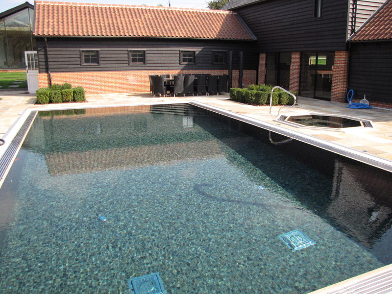 Residential-tiled-outdoor-pool-with-inground-spa